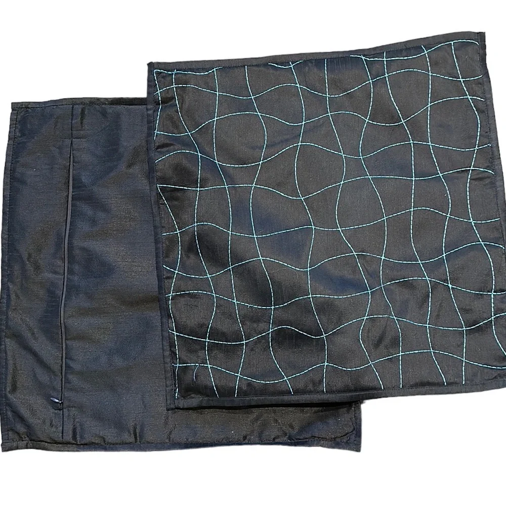 Two 18 x 18 brown with blue design pillow covers
